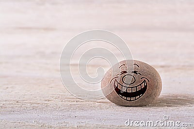 Emoticon with tears of joy Stock Photo