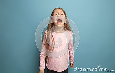 The emotional blonde teen girl have a happiness look and screaming. Studio shot Stock Photo