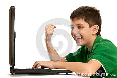 Emotional boy is playing computer game Stock Photo