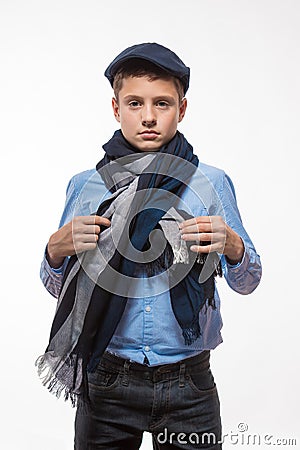 Emotional brunette boy in a cap and scarf Stock Photo