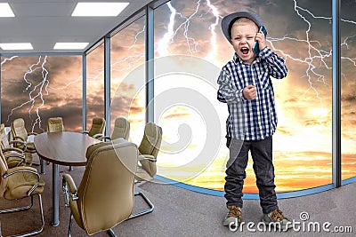 Little boss talks on his mobile phone.Emotional conversation. Stock Photo