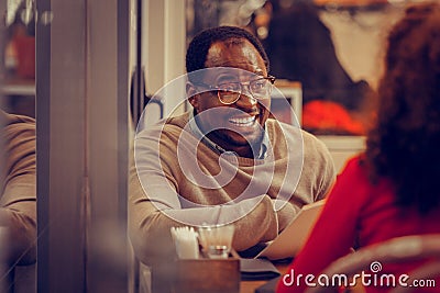 Bearded emotional father sitting in front of his daughter Stock Photo