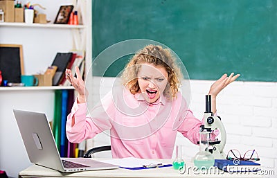Emotional female teacher educator in classroom chalkboard background. Emotional people concept. Woman tutor or student Stock Photo