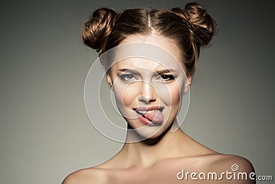 Emotional girl. Beautiful modern model shows tongue Positive woman hipster. Emotions on face. Stock Photo