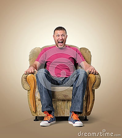 Emotional male spectator in the chair. Stock Photo