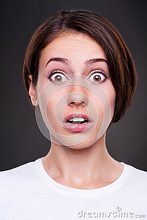 Emotional portrait of amazed woman Stock Photo