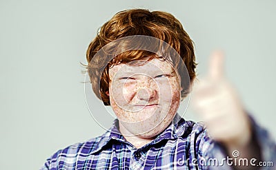 Emotional portrait of red-haired boy Stock Photo