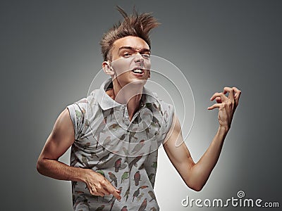 Emotional portrait of a teenager playing on air guitar Stock Photo