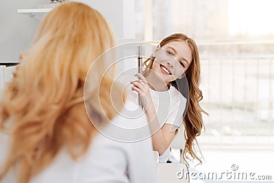 Emotional pretty young lady glad hearing results Stock Photo