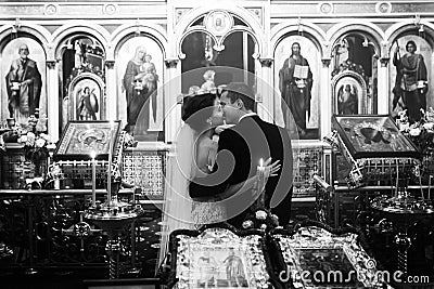 Emotional religious wedding bride and handsome confident groom k Stock Photo