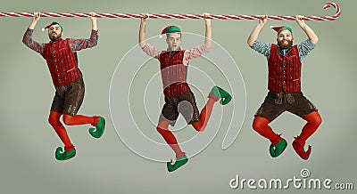 Emotional Santa Clause`s elves greeting with New Year and Christmas, copyspace Stock Photo