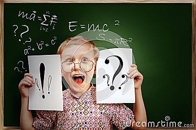 Emotional screaming pupil boy near chalkboard Stock Photo