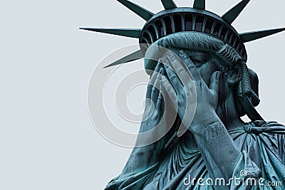 Emotional statue of liberty with her head in hands. American state of grief and depression Stock Photo