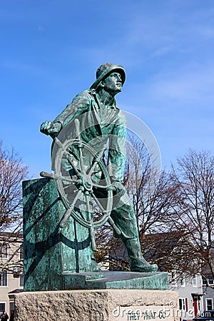 Emotional statue of sailor at the helm, honoring ones lost at sea, Fisherman`s Memorial, Gloucester, Mass, 2018 Editorial Stock Photo