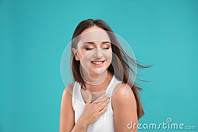 Emotional young woman in casual outfit on background Stock Photo