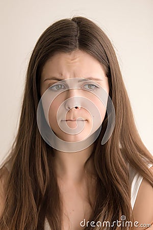 Emotive headshot portrait of sad young woman Stock Photo