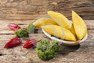 Empanadas and hot pepper on wooden background, traditional Colombian food Stock Photo