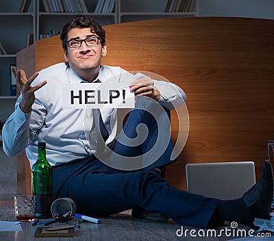 Employee asking for help and drinking under stress and despair Stock Photo