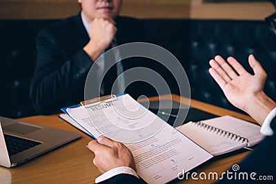 Employee is describing his work experience for the interviewer Stock Photo