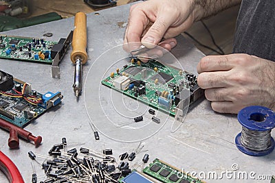 An employee at an electric service while at work. Stock Photo