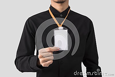 Employee hand showing blank id card badge holder for mockup Stock Photo