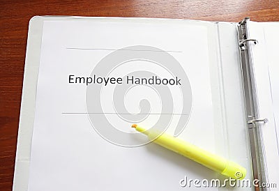 Employee Handbook on a desk Stock Photo