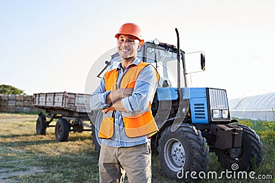 Employee in orange jacket near vehicle Stock Photo