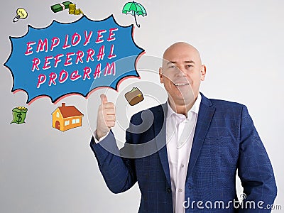 EMPLOYEE REFERRAL PROGRAM phrase on the gray wall Stock Photo