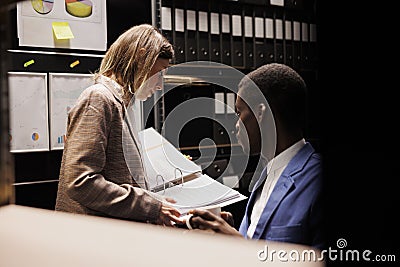 Employees analyzing bureaucracy record Stock Photo