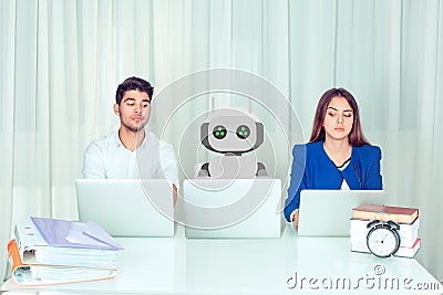 Employees with colleagueâ€ robot spying at workplace Stock Photo