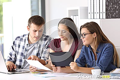 Employees coworking on line at office Stock Photo