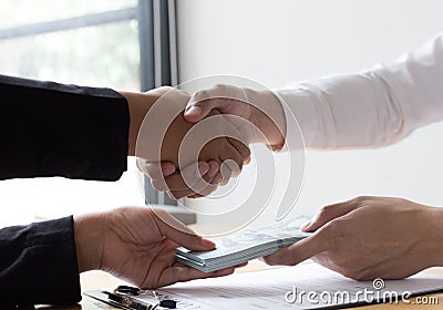 Employees give money to bribe with the chief. To be promoted Stock Photo