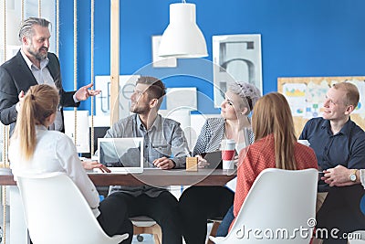 Employees listening to their manager Stock Photo