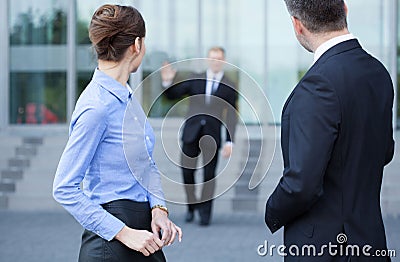 Employees talking in front of business centre Stock Photo