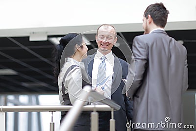 Employees are talking in the lobby of the office Stock Photo