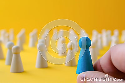 Employer chooses takes in hand employee. Leader stands out from crowd. representing leadership, individuality,. Stock Photo