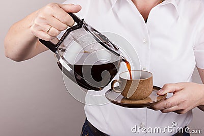 Employing coffee in a cup Stock Photo