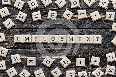 Employment word on wooden background. Stock Photo