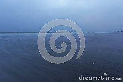 Emply ocean view from remote place at dusk, Lonely wandering in Dark beach Stock Photo