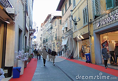 Empoli,Tuscany, Italy. Town street in the evening in festive lighting with a lots of people Editorial Stock Photo