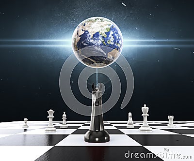 Empowering of the Earth with Chess on the chessboard. Chess business concept, leader & success. Stock Photo