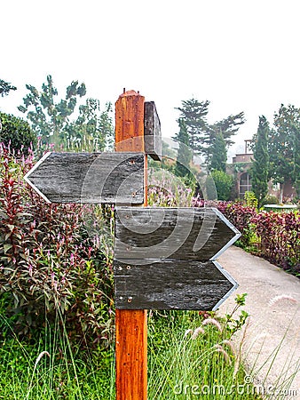 Emptied wooden direction sign Stock Photo