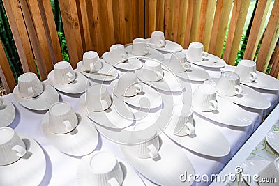 Emptry cup of tree arranged on table with wood barttens background Stock Photo