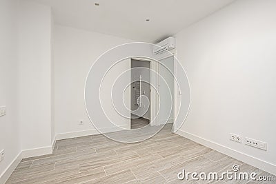 Empty air-conditioned bedroom with porcelain stoneware floors Stock Photo
