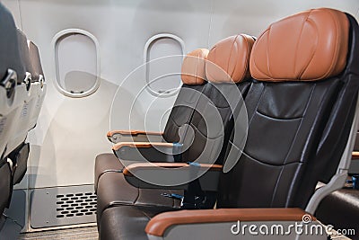 Empty aircraft seats and windows, passenger seat interior airplane Stock Photo