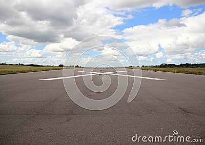 Empty airplane runway with white cross Stock Photo
