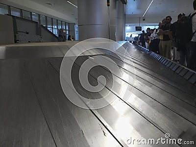 Empty airport luggage belt in motion Editorial Stock Photo