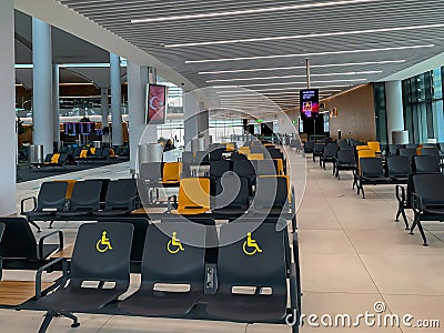 Empty airport seats and halls no people during covid-19 corona virus pandemic epidemy in the world quarantine. Horizontal image Editorial Stock Photo