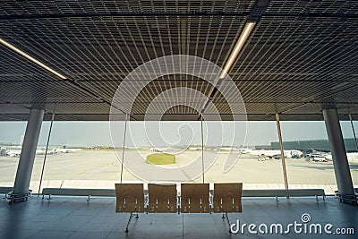 Empty airport terminal due to coronavirus pandemic and suspended airline flights. Empty airport terminal. Mechanical corridor with Stock Photo