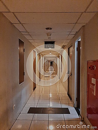 empty apartment hallway with exit sign Stock Photo